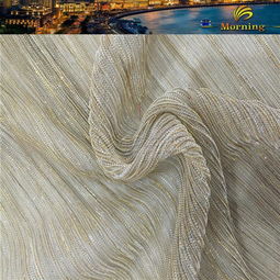 舞台魅力与礼服华彩 全涤针织幻灯丝压皱亮丝网布的时尚之旅